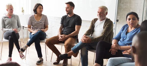 Group of people sitting and talking together