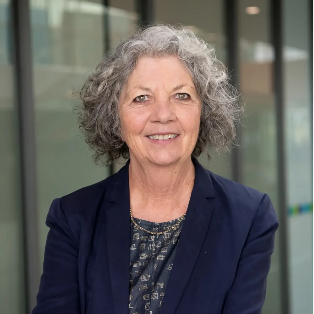 Professional headshot of a smiling woman.