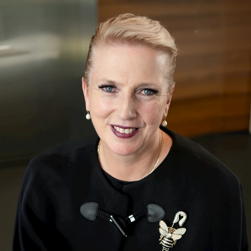 Professional headshot of a smiling woman