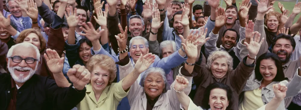 Group of people with their hands in the air.